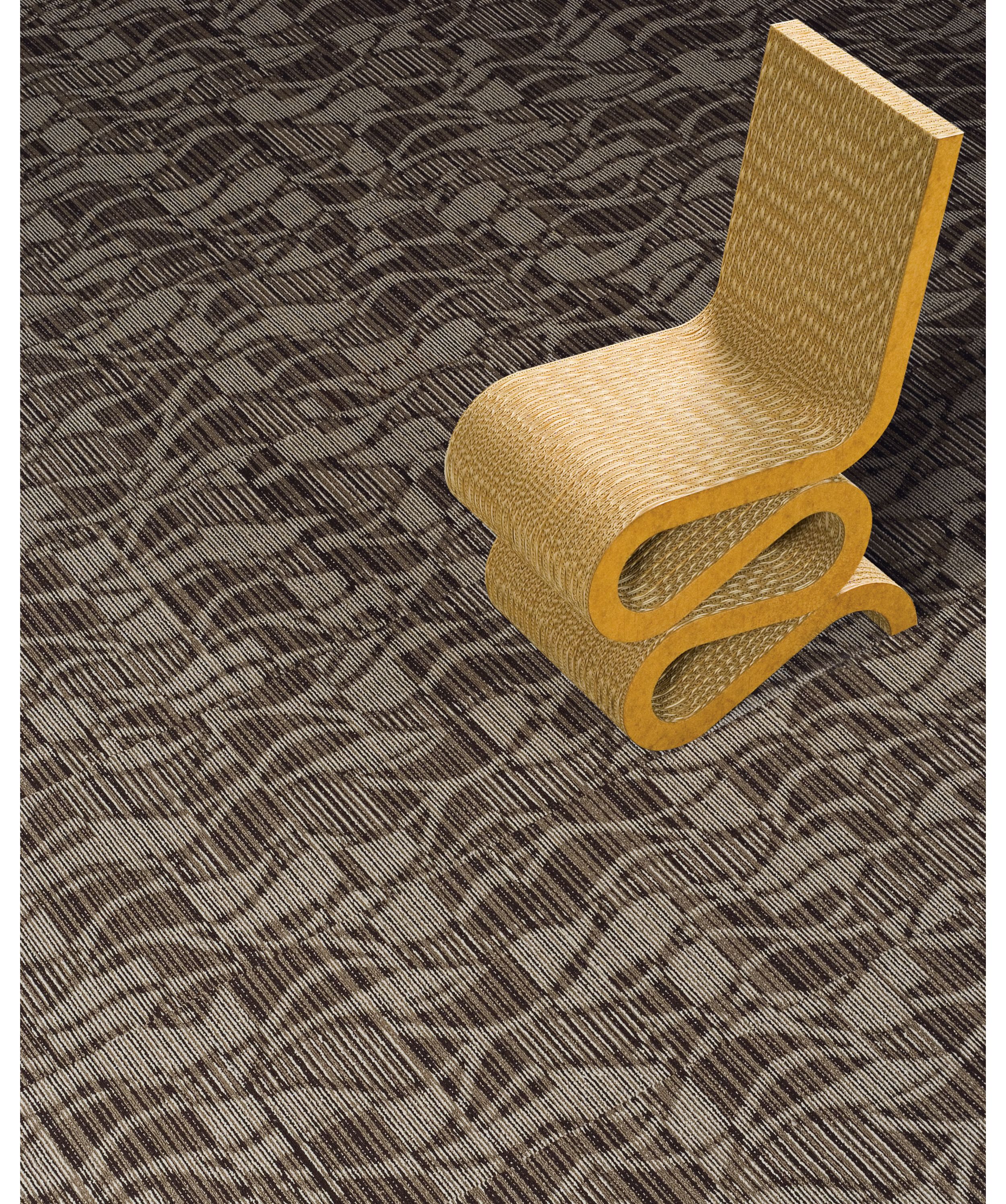 Interface Miramar carpet tile in close up with curvy chair image number 1